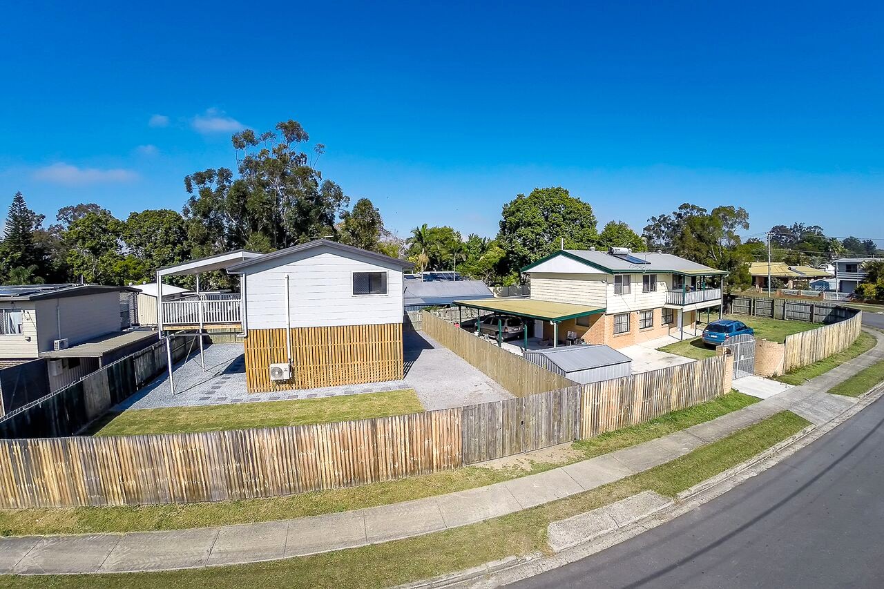 The same corner today — the original house and the high-set granny flat, each with its own street access