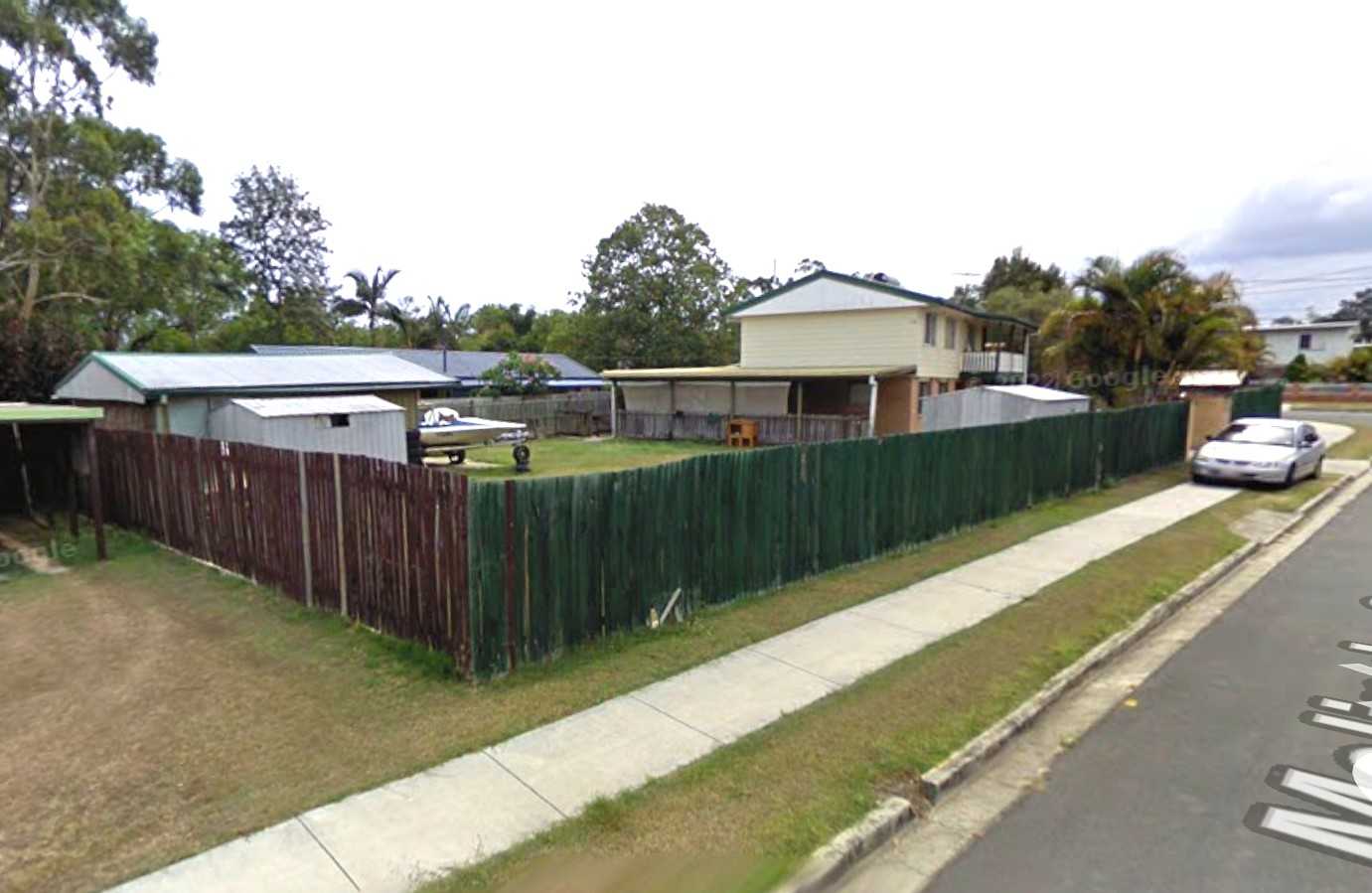 The corner block in 2014 — one house, open yard